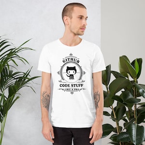 May include: White t-shirt with a black and white graphic design featuring the GitHub logo and the text "GitHub Code Stuff Like a Pro".