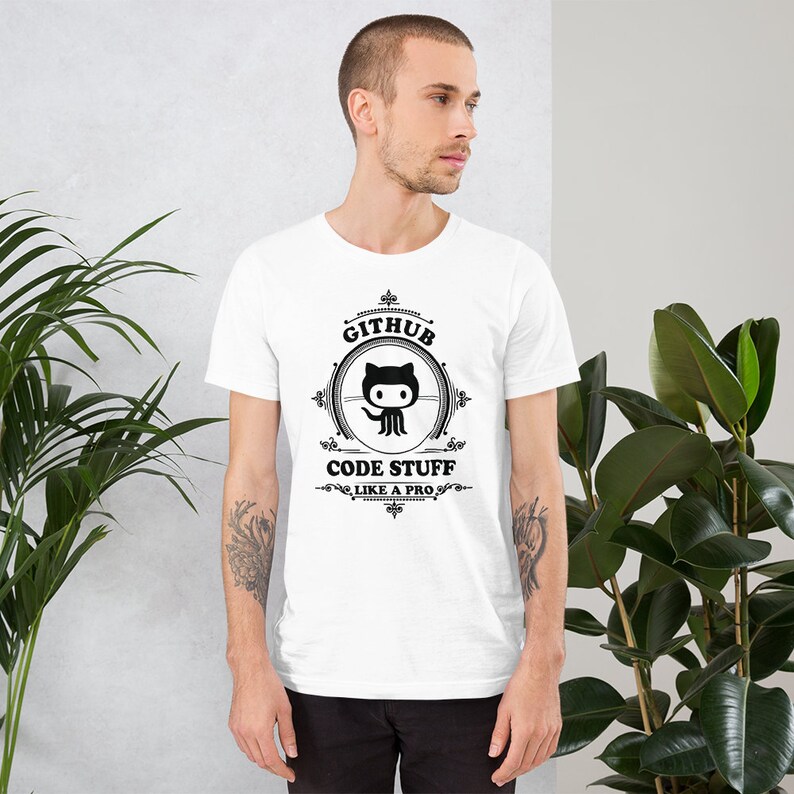May include: White t-shirt with a black and white graphic design featuring the GitHub logo and the text "GitHub Code Stuff Like a Pro".