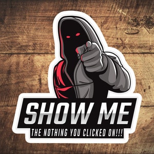 May include: A black and gray hooded figure with red eyes points at the viewer with the text "SHOW ME THE NOTHING YOU CLICKED ON!!!" in white letters on a black background.