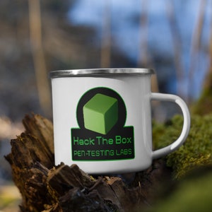 May include: White enamel mug with a green and black logo that says "Hack The Box Pen-Testing Labs".