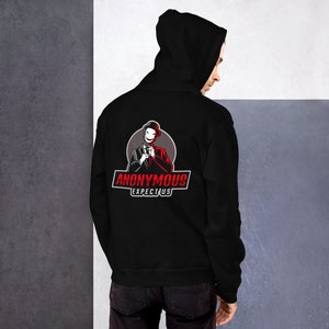 May include: Black hooded sweatshirt with a graphic of a man in a suit and hat with the text "Anonymous Expectus" on the back.