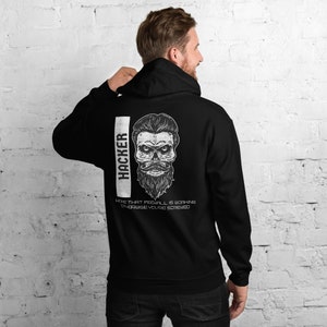 May include: Black hooded sweatshirt with a white skull graphic and the text "HACKER" and "HOPE THAT FIREWALL IS WORKING OTHERWISE YOU'RE SCREWED".