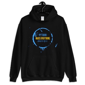 May include: Black hoodie with the text "PYTHON MAKES EVERYTHING POSSIBLE" in a blue circle design. The hoodie is displayed with jeans, sneakers, headphones, and a smartphone.