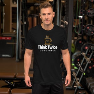 May include: Black t-shirt with a white graphic of a coffee cup with steam and the text "Think Twice Code Once".