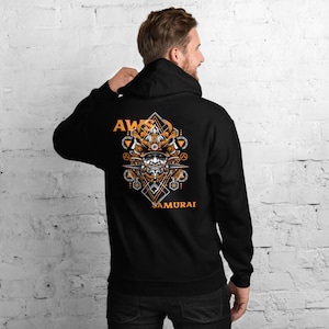 May include: Black hooded sweatshirt with an orange graphic of a samurai warrior's helmet with the text "AWS SAMURAI" on the back.