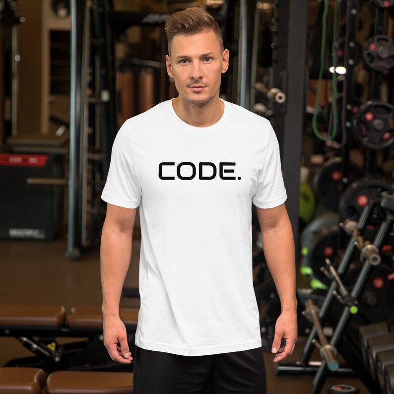 May include: White t-shirt with black text that reads "CODE."