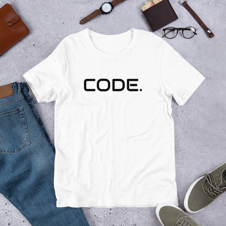 May include: White t-shirt with black text that reads "CODE."