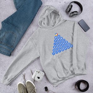 May include: A grey hooded sweatshirt with a blue triangle design featuring various symbols and icons. The design is centred on the front of the sweatshirt.
