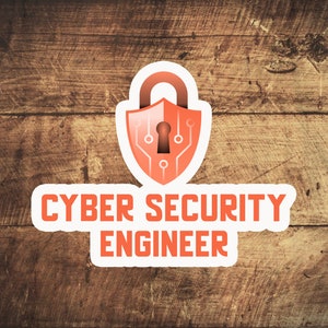 May include: A white sticker with an orange padlock and the text "Cyber Security Engineer". The padlock has a keyhole and circuit board design.
