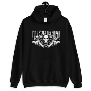 May include: Black hooded sweatshirt with a white graphic design that says "Full Stack Developer In Code We Trust" with a skull and crossbones.