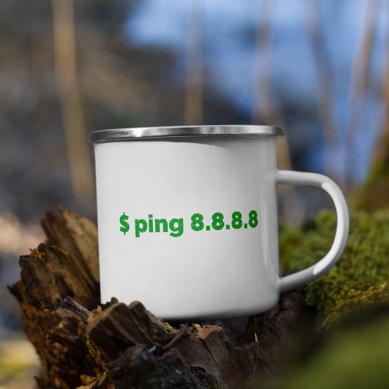 May include: White enamel camping mug with a green '$ ping 8.8.8.8' graphic.