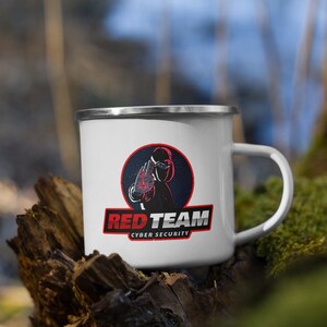 May include: White enamel mug with a red and black logo that says "Red Team Cyber Security". The logo features a black figure with a red hand in front of their face.