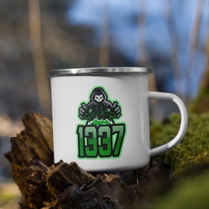 May include: White enamel camping mug with a green and black graphic of a hooded figure with a skull face and the text "1937".