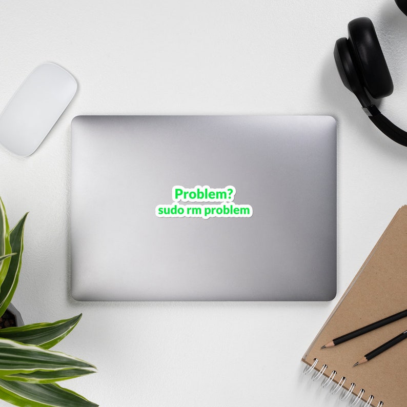 May include: A white laptop with a green sticker that says "Problem? sudo rm problem"
