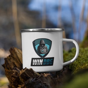 May include: White enamel mug featuring a black and blue logo of a hooded figure using a laptop. The logo is within a shield shape with the text "WINDBG" underneath.