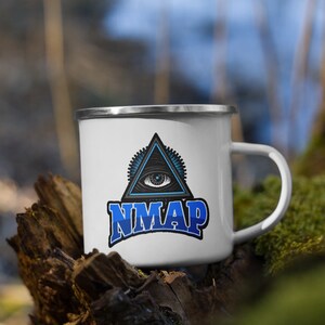 May include: White enamel camping mug with a blue and black all-seeing eye graphic and the text "NMAP" in blue.