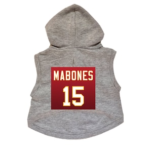 May include: Gray sleeveless hoodie with a red and gold jersey patch on the back. The jersey patch has the name "MABONES" and the number "15" on it.