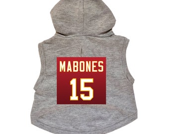 May include: Gray sleeveless hoodie with a red and gold jersey patch on the back. The jersey patch has the name "MABONES" and the number "15" on it.