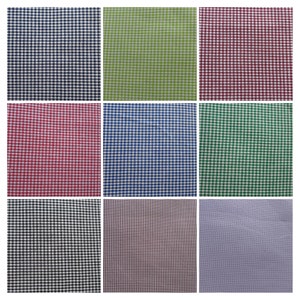 May include: Nine fabric swatches with a gingham pattern in various colours, including red, green, blue, black, and white.