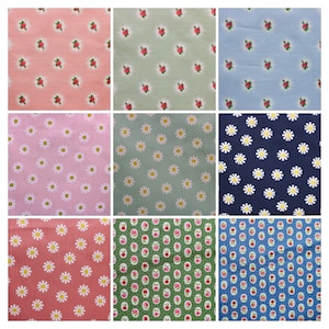 May include: Nine fabric swatches featuring various floral patterns. The designs include pink and white daisies, green and white daisies, blue and white daisies, green and red roses, and blue and red roses.