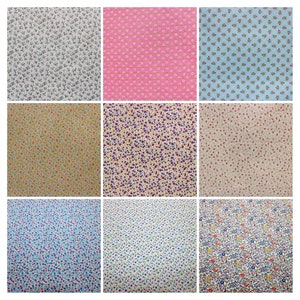 以下が含まれることがあります： さまざまな花柄のファブリック見本が9種類あります。パターンには、ピンクの背景に小さな白い花、薄い青の背景に小さな青い花、ベージュの背景に小さなオレンジの花、黄色の背景に小さな紫の花、ベージュの背景に小さな赤い花、白い背景に小さな青い花、薄い青の背景に小さな白い花、白い背景に小さな黄色の花、そして白い背景に小さな青い花に赤と黄色のアクセントがついたものがあります。