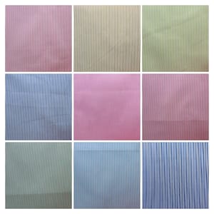 Könnte beinhalten: Neun Stoffmuster mit unterschiedlichfarbigen Streifen. Die Muster sind in drei Reihen zu je drei angeordnet. Die Farben umfassen Pink, Gelb, Grün, Blau und Weiß.