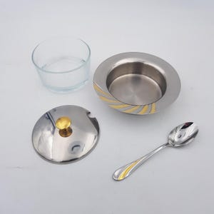 Sugar bowl / Jam pot | Stainless Steel with gilt ornaments | Glass bowl | Spoon | Vintage Italy 1980/90s | See details below