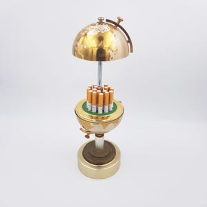 1960s Vintage cigarettes dispenser shape of a small earth globe | Pull the top and the cigarettes will appear | See details below