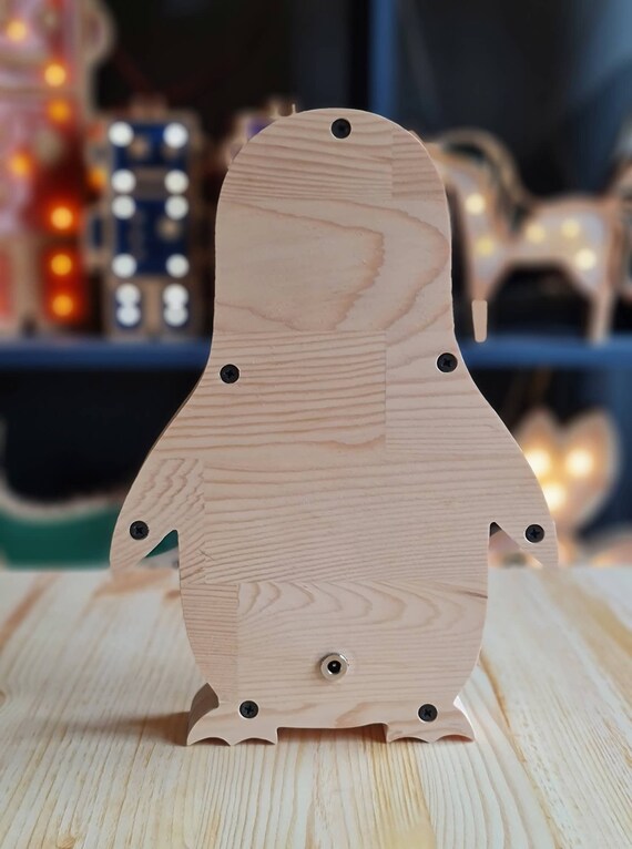 LED night light shaped like a smiling penguin