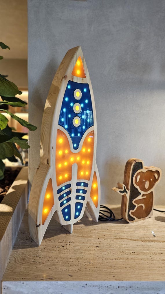 Unique space rocket lamp styled for a toddler’s space adventure room