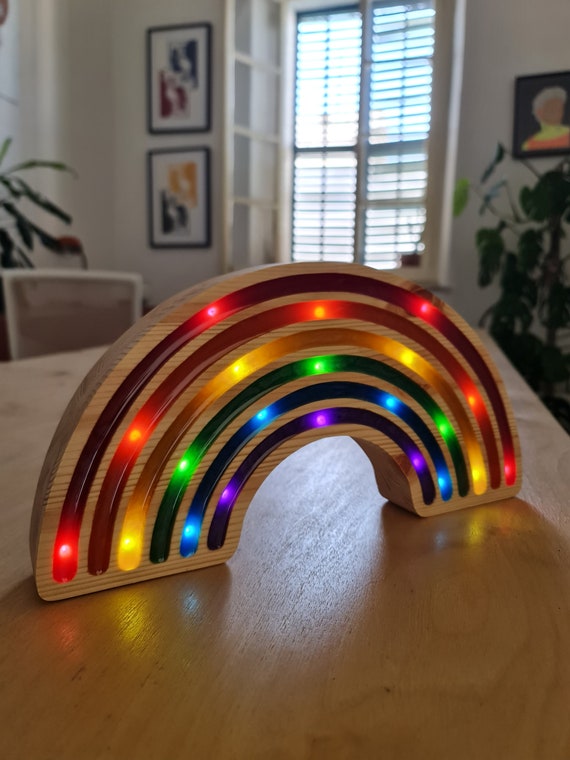 Vibrant rainbow nightlight designed for toddlers’ bedtime comfort.