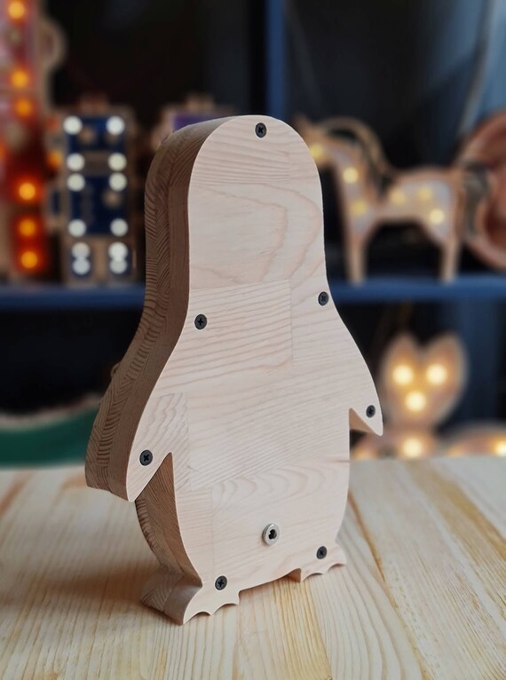 Nursery decor lamp shaped like a cozy penguin