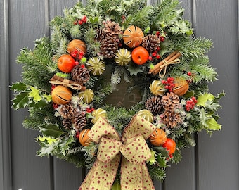 Real Handmade Christmas Door Wreath, with dried green and orange oranges, apple picks, cones and berries.