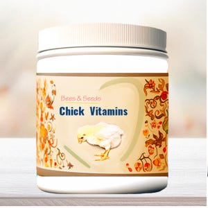 May include: A white plastic container with a screw-on lid. The label reads "Bees & Seeds Chick Vitamins" with a graphic of a yellow chick. The label has a beige background with floral and leaf designs.