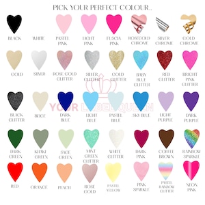 May include: A color chart featuring rows of heart-shaped icons in various shades, textures, and finishes, including matte, glitter, metallic, and sparkle options. The text PICK YOUR PERFECT COLOUR and YOUR LABEL QUEEN is visible on the display.