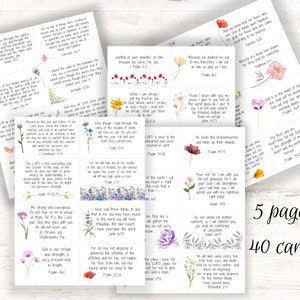 May include: A set of 40 inspirational cards featuring colorful floral designs and Bible verses. The cards are printed on white cardstock and have a matte finish.