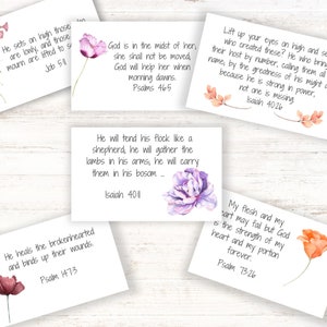May include: Set of 10 inspirational quote cards with watercolor floral designs. Each card features a different Bible verse and a floral illustration. The cards are printed on white cardstock and are perfect for adding a touch of faith and beauty to your home or office.