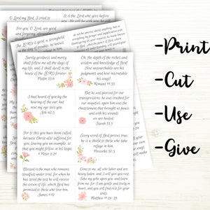 Stack of printable papers with scripture cards you cut out on each page.  Words next to papers say.  Print, Cut, Use, Give.  Cards have encouraging bible verses in a cursive gray script, with beautiful pink flowers on each car.