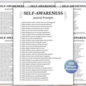 May include: Several white paper sheets with the text "SELF-AWARENESS Journal Prompts" and a floral design. The prompts are numbered and include questions about emotions and feelings. A blue circle reads "200 Unique Prompts".