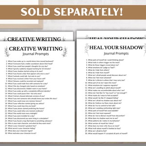 May include: Two journal prompt pages, "Creative Writing" and "Heal Your Shadow", are displayed on a wooden desk. The "Creative Writing" page has 30 prompts. The "Heal Your Shadow" page also has 30 prompts. The text "SOLD SEPARATELY!" is at the top.