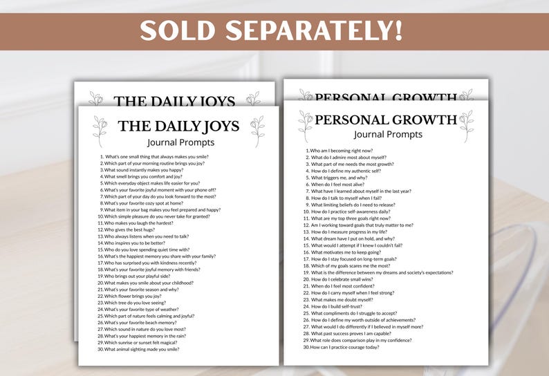 Puede incluir: Dos hojas de indicaciones para diarios, "The Daily Joys" y "Personal Growth", con detalles florales. Cada hoja presenta una lista de preguntas dise&ntilde;adas para la autorreflexi&oacute;n y la escritura en un diario. El texto "SOLD SEPARATELY!" est&aacute; en la parte superior.