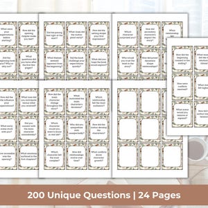 May include: A collection of printed cards with book-related questions, arranged on a wooden surface. The cards have a decorative border and are grouped in sets. The text "200 Unique Questions | 24 Pages" is displayed at the bottom.