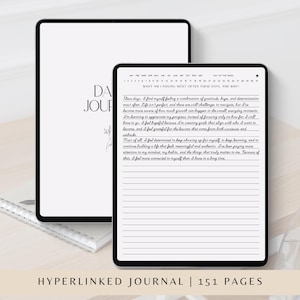 May include: Two digital tablets displaying a daily journal interface. The larger tablet shows a cover page with the text DAILY JOURNAL, while the smaller tablet displays a lined page with handwritten text and a calendar header at the top.