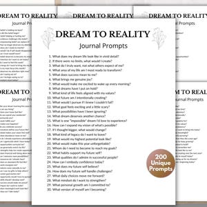 May include: A collection of white paper sheets featuring black text titled Dream to Reality Journal Prompts. The pages contain numbered lists of reflective questions and a circular brown badge stating 200 Unique Prompts in white text.