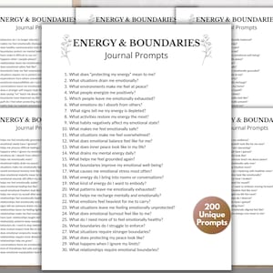May include: A stack of white paper sheets with the text "ENERGY & BOUNDARIES Journal Prompts" and a list of questions. A brown circular sticker with the text "200 Unique Prompts" is also visible.