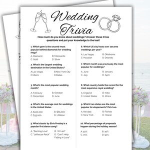 May include: Two white sheets of paper with wedding trivia questions. The top sheet has the title "Wedding Trivia" with illustrations of champagne glasses and wedding rings. The questions cover wedding facts.