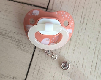Pacifier badge reel