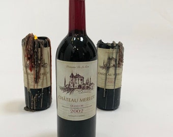 Wine bottle shaped candle . Chateau Merlot burns in a very gothic style. Perfect for dinner parties!!