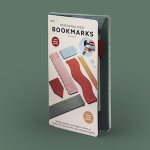 May include: A DIY kit for personalised bookmarks. The kit contains six stylish bookmarks in various shapes and colours, with text such as "WE LOVE YOU NAN" and "A THOUSAND TIMES OVER". The packaging reads "PERSONALISED BOOKMARKS DIY KIT".
