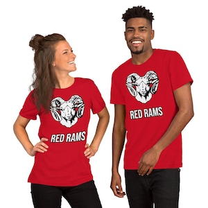 May include: Two red t-shirts with a white ram head graphic and the text "RED RAMS" printed on the front.